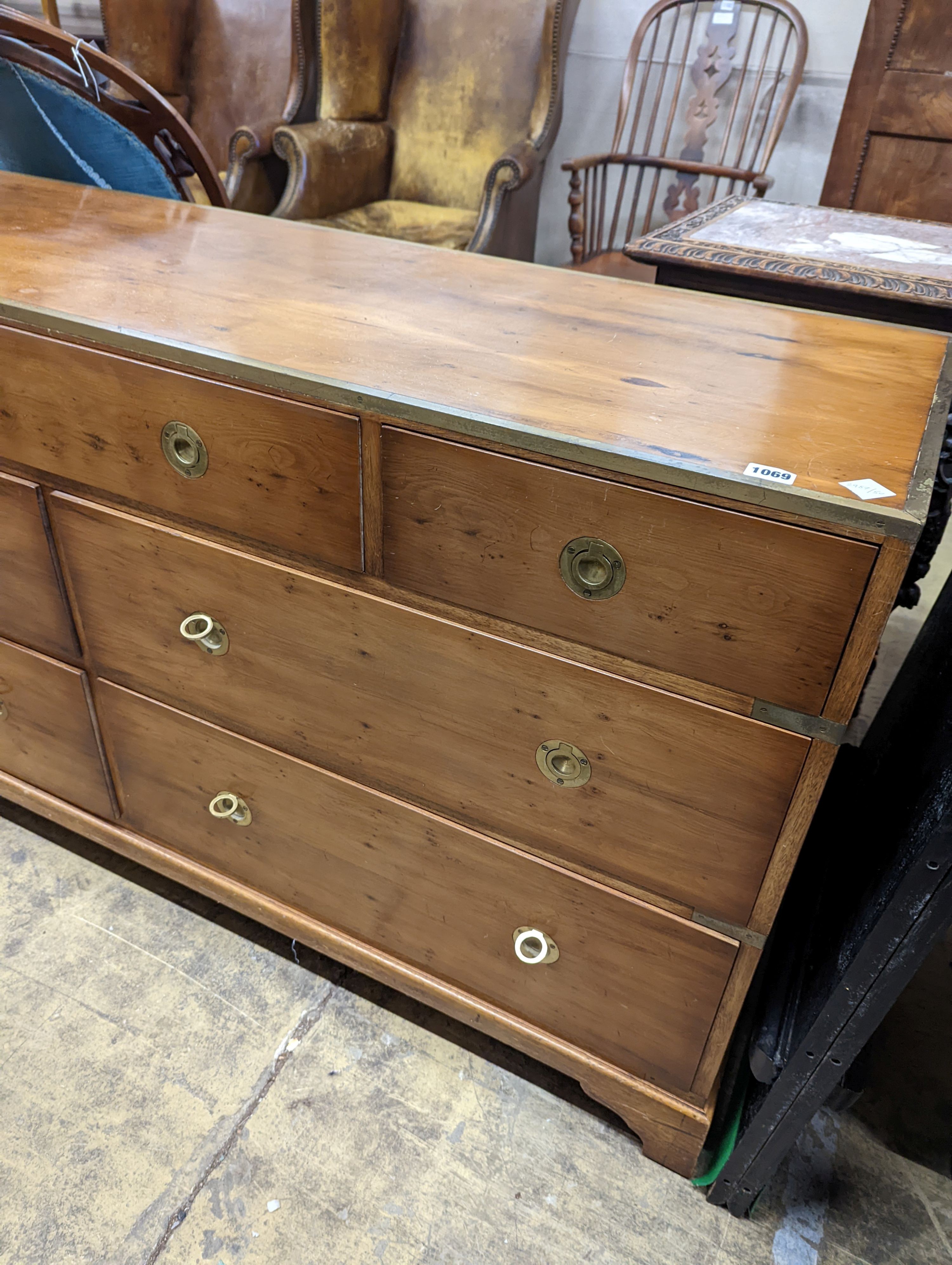 A reproduction brass mounted Military style yew veneered chest, width 153cm depth 46cm height 78cm